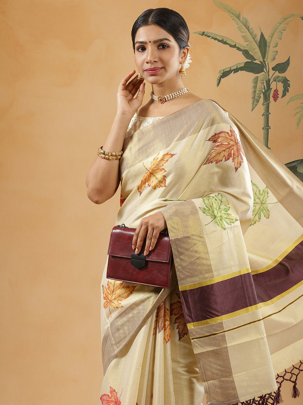 Golden Tissue Brown Border Set Saree With Maple Leaf Print All Over Body