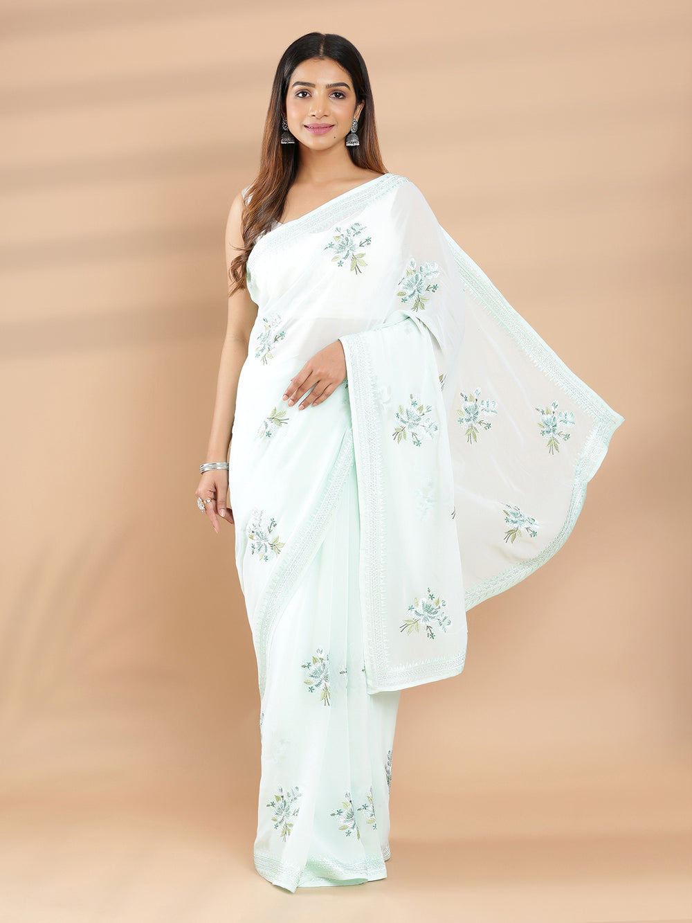 Light Sea Green Color Georgette Saree Mini Stone And Embroidery Work On Body