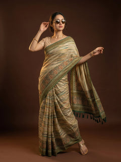 Woman wearing a traditional saree with a brown background