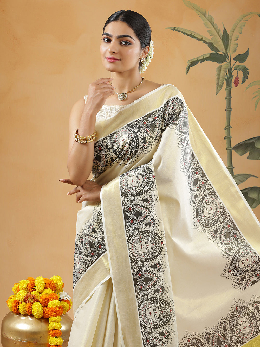 Golden Tissue Set Saree With Black Mural Print Of Devi Near Golden Kasavu Border