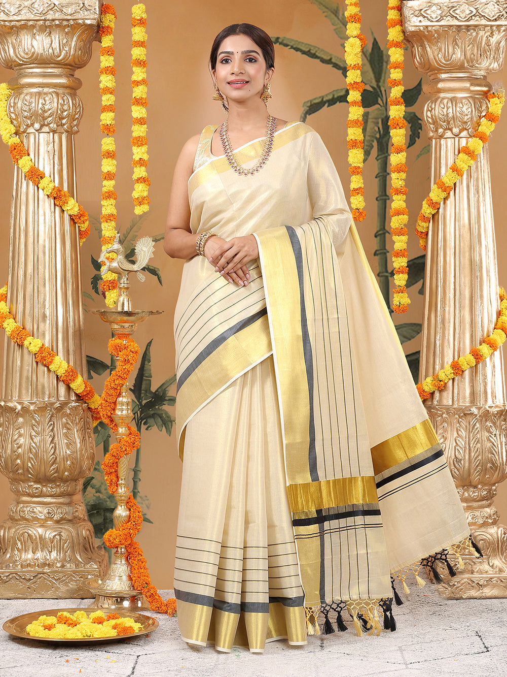 Golden Tissue Saree with Black Kasavu Border & Black-Cream Tassels