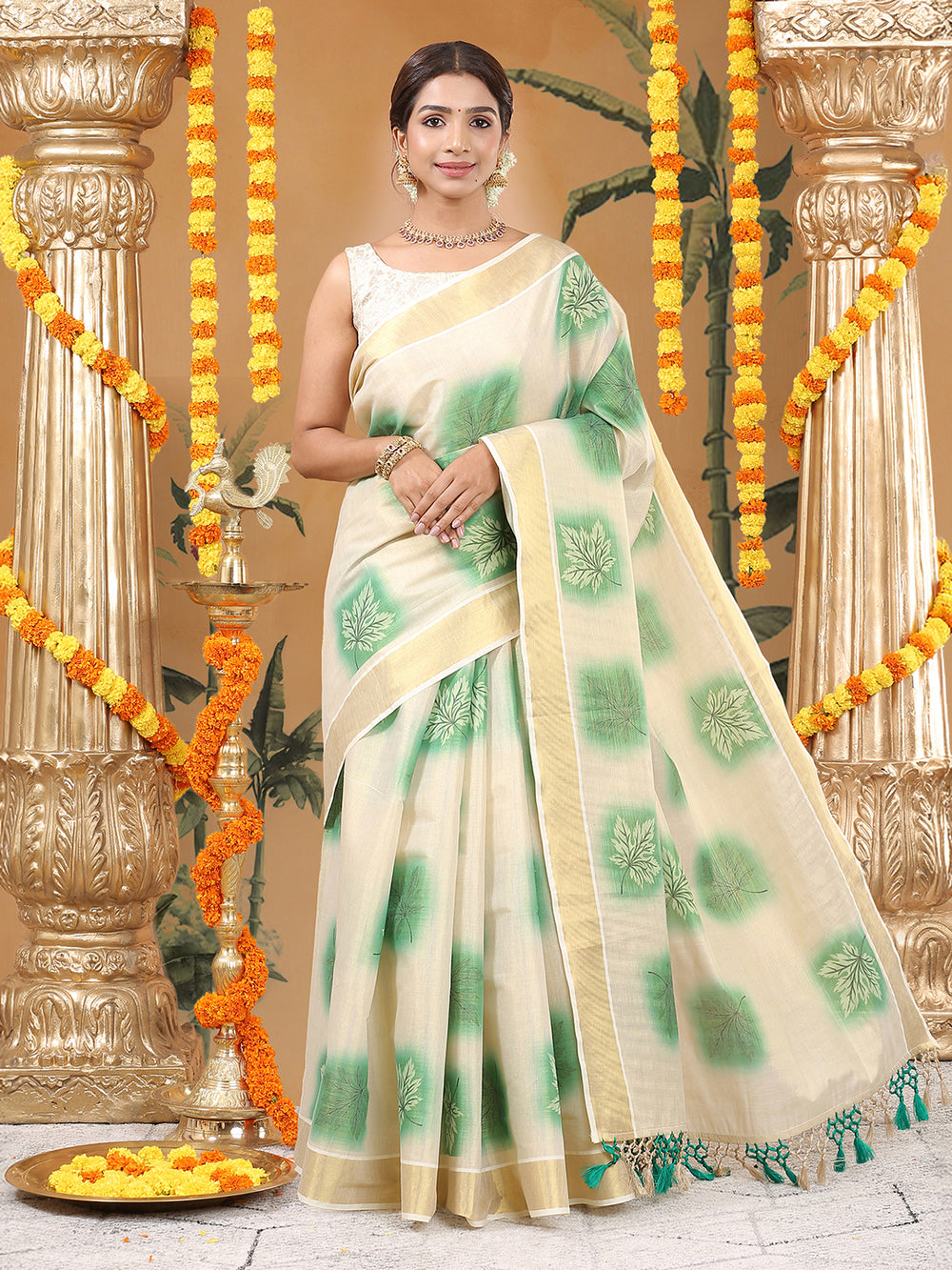 Golden Tissue Saree with Green Leaf Buttas, Tassels & Kasavu Border