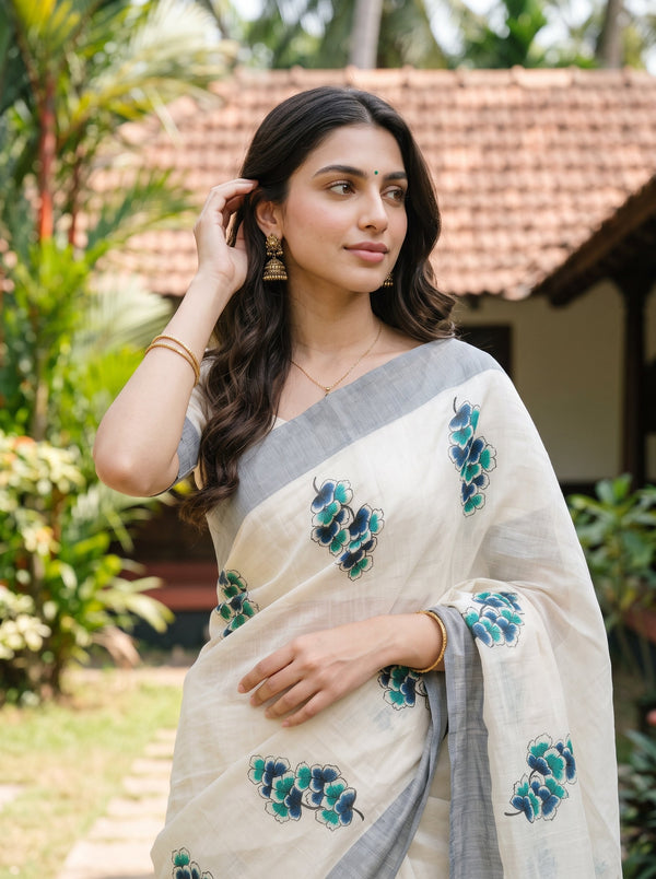 Tissue Cream Kerala Saree with Blue-Green Floral Print Pallu, Golden Zari and Navy Striped Border