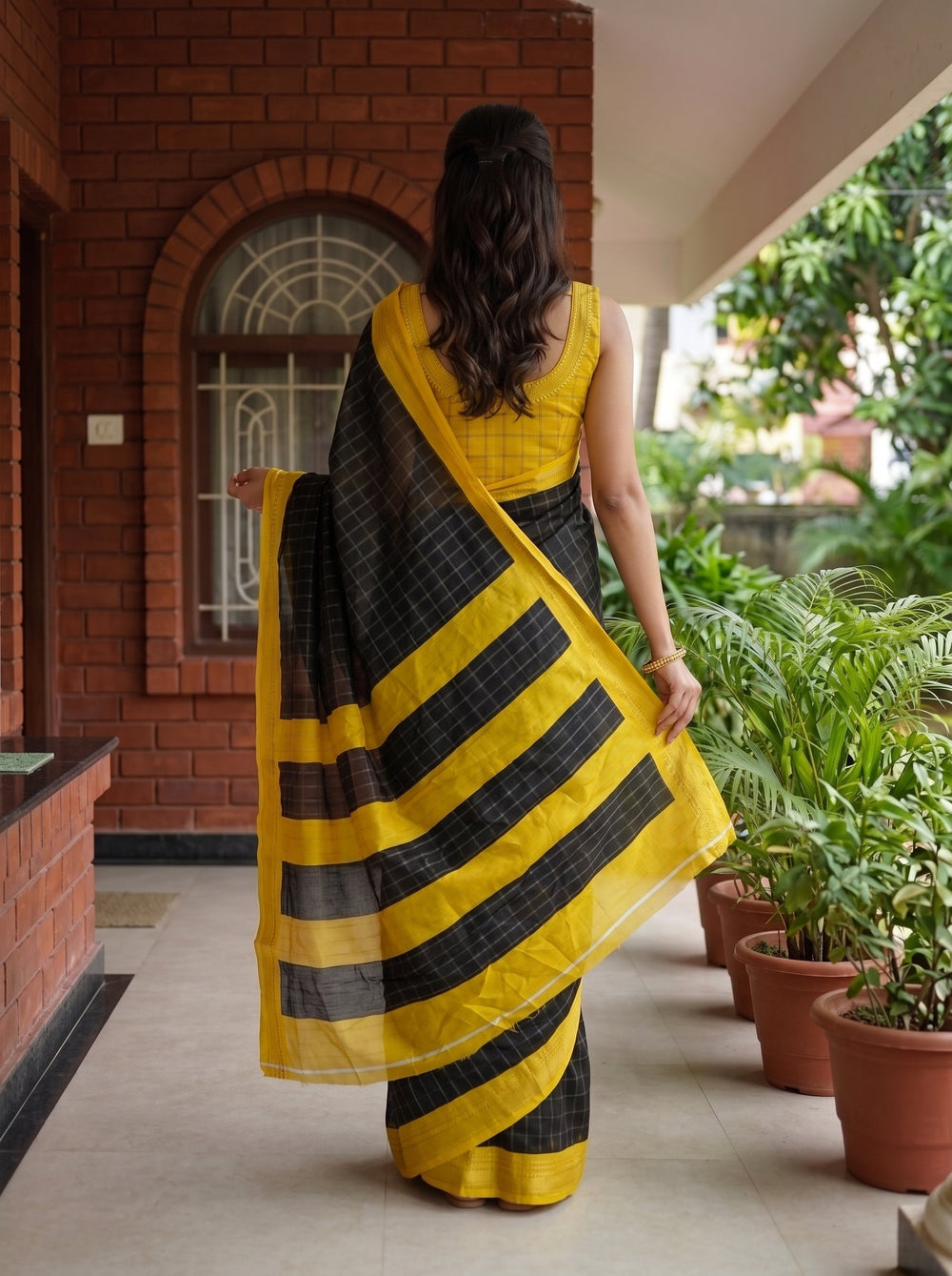 Synthetic Black Checked Saree with Golden Yellow Border