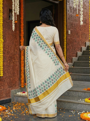 Cotton Cream Green Peacock Eye Motif Border with Golden Zari Border Onam Special Kerala Saree