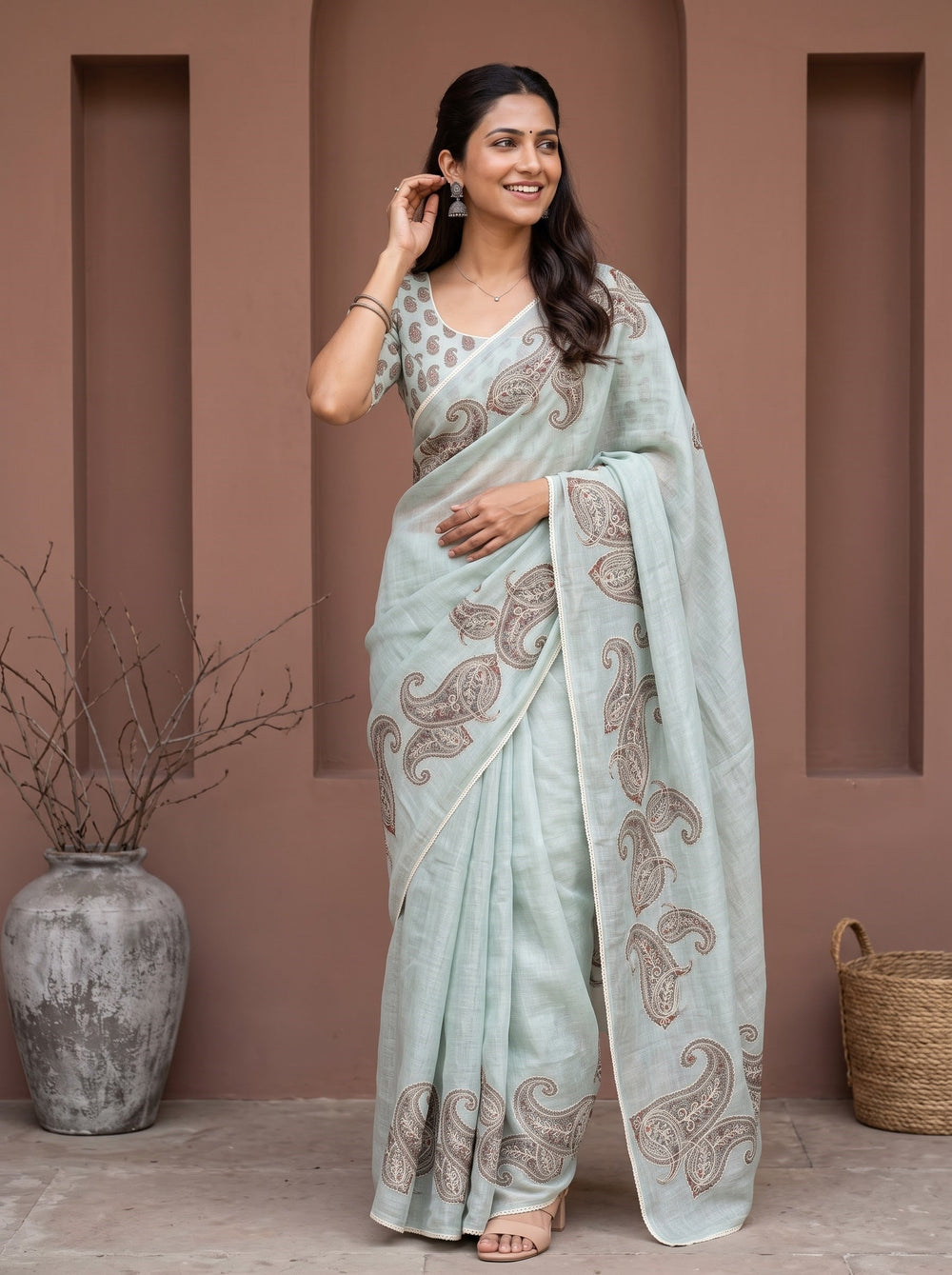 Tissue Saree in Pastel Blue with Intricate Paisley Embroidery and Sequin Detailing