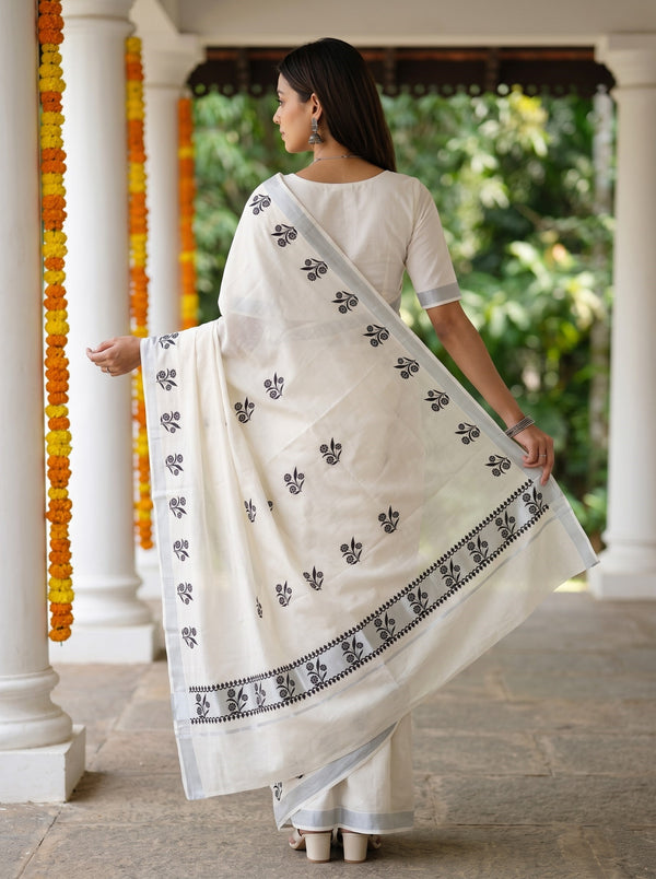 Cotton White Kerala Saree with Black Floral Print Pallu and Silver Zari Border