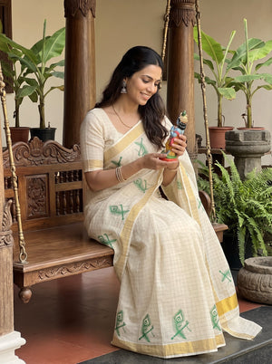Tissue Cream Peacock Feather Print Kerala Saree with Golden Zari Border
