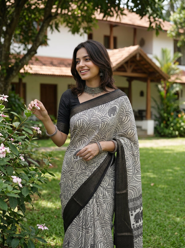 Synthetic Black White Elephant Motif Printed Saree with Traditional Woven Border