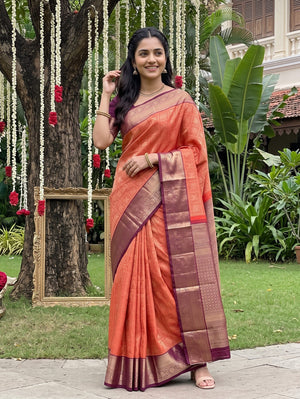 Kanjivaram Brocade Saree in Rust Orange with Wine Zari Floral Pallu