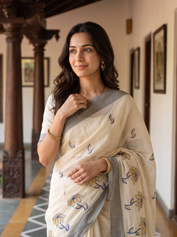 Tissue Cream Golden Navy Blue Floral Embroidered Pallu Broad Blue Zari Border Kerala Saree