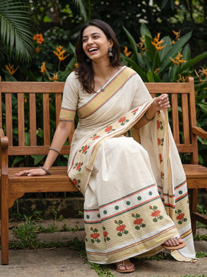 Cotton Cream Orange Lotus Print Kerala Saree with Green Polka Dot Border