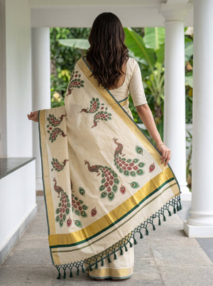 Tissue Cream Kerala Saree with Peacock Print Pallu, Golden Zari Border and Tassels