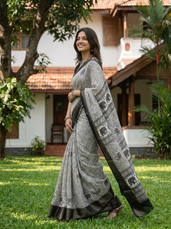Synthetic Black White Elephant Motif Printed Saree with Traditional Woven Border
