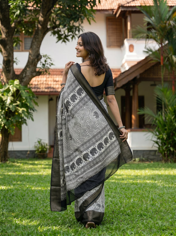 Synthetic Black White Elephant Motif Printed Saree with Traditional Woven Border