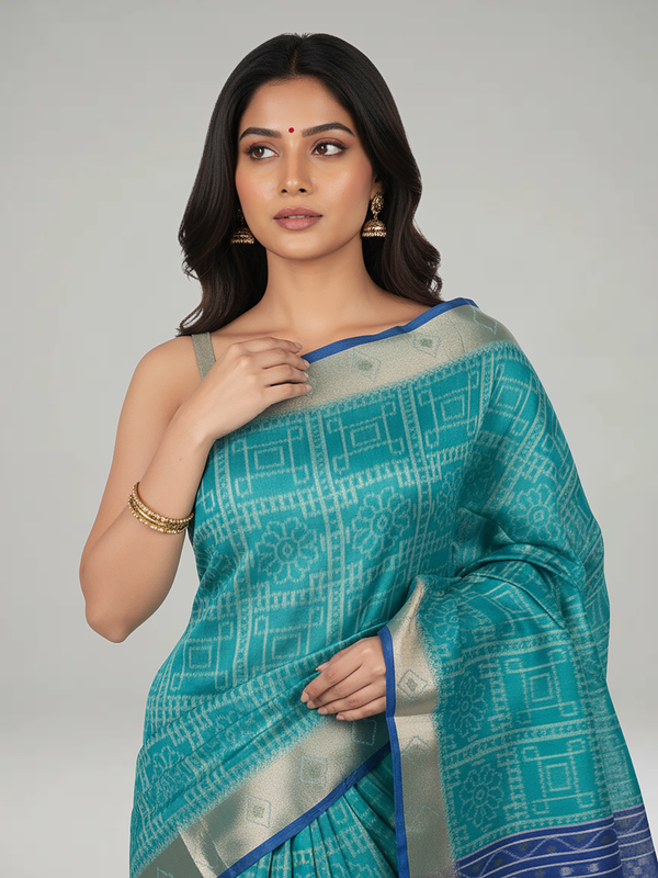Teal Blue Semi Jute Silk saree with Printed Body, Contrast With Printed Pallu & Plain Bavanji Border Border – Paired with Egyption Blue Plain With Border Blouse