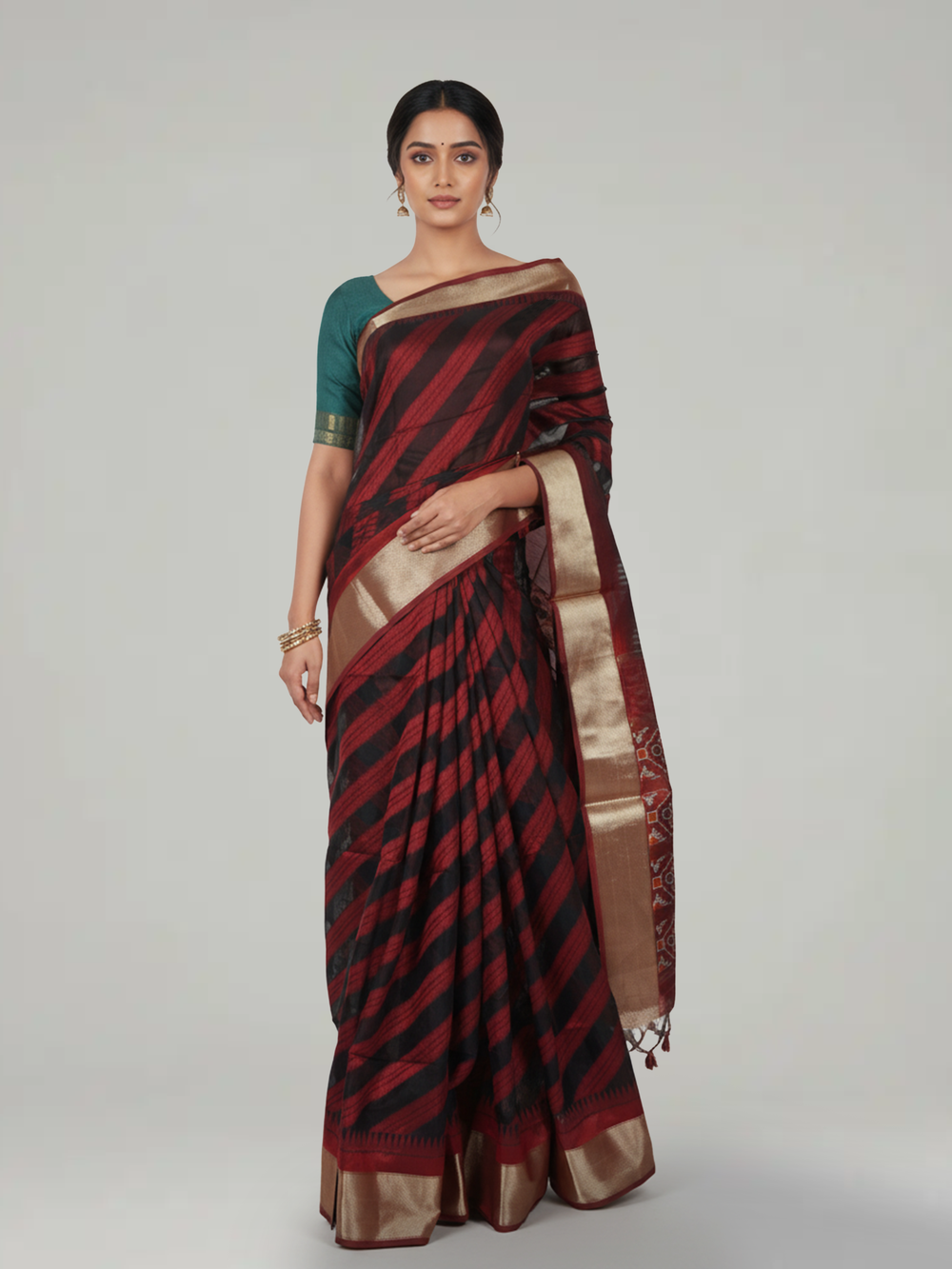 Maroon Ikat Semi Silk Saree with Diagonal pattern Body, Ikat Pattern Pallu & Antic Gold Bavanji Border Border – Paired with Maroon Ikat Design Blouse
