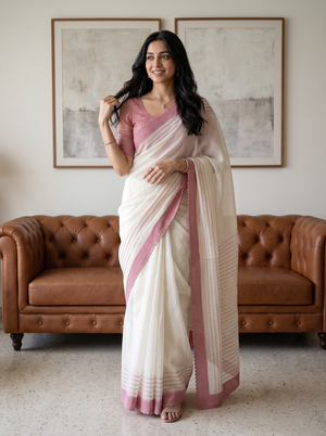 Net Kota Off White Saree with Pink Striped Pattern and Floral Motif Pallu with Textured Pink Border