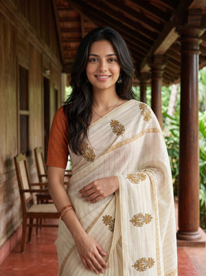 Semi Tussar Silk Cream Saree with Floral Embroidery border and Tassel Detailing