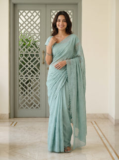 Net Kota Saree in Aqua Green with All-Over Floral Embroidery and Scalloped Border