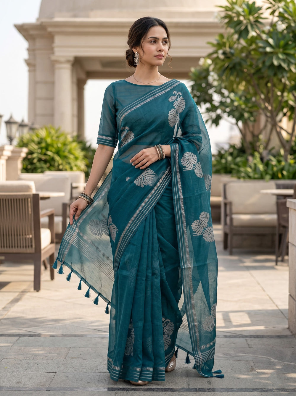 Organza Teal Self-Tone Botanical Motif Saree with Striped Pallu Border and Tassels
