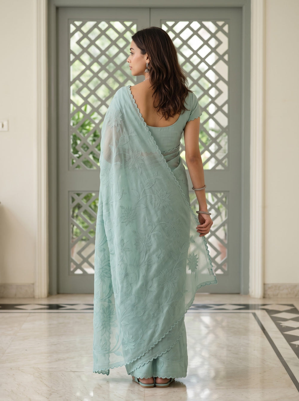 Net Kota Saree in Aqua Green with All-Over Floral Embroidery and Scalloped Border