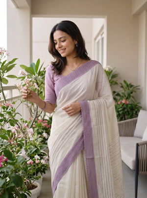Net Kota Off White Saree with Lavander Striped Pattern and Floral Motif Pallu with Textured Lavander Border