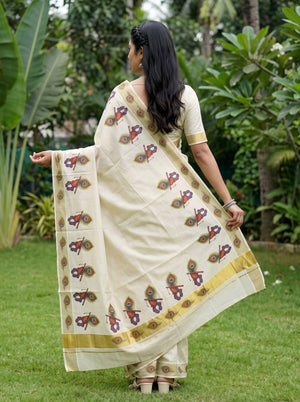 Tissue Cream Kerala Saree with Krishna Peacock Feather Print Pallu and Golden Zari Border