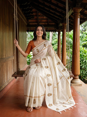 Semi Tussar Silk Cream Saree with Floral Embroidery border and Tassel Detailing