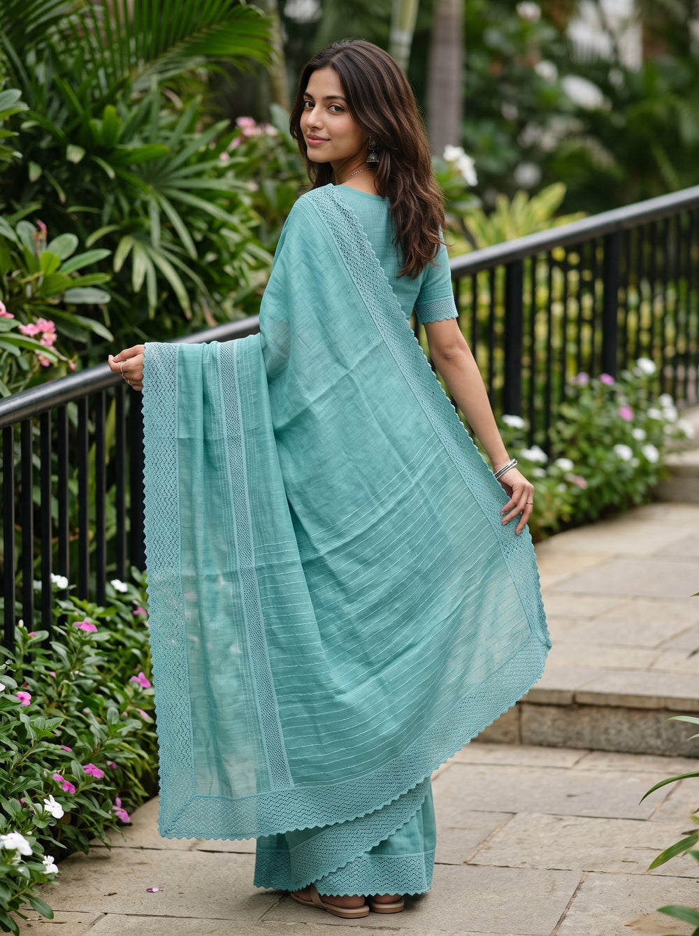 Cotton Linen Teal Saree with Woven Stripe Details and Intricate Lace Border