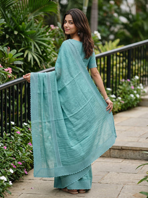 Cotton Linen Teal Saree with Woven Stripe Details and Intricate Lace Border