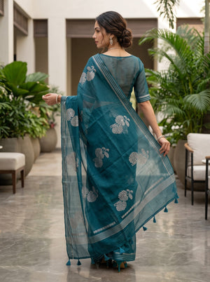 Organza Teal Self-Tone Botanical Motif Saree with Striped Pallu Border and Tassels