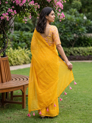 Chiffon Yellow Saree with Sequin Dots and Pink Tassels
