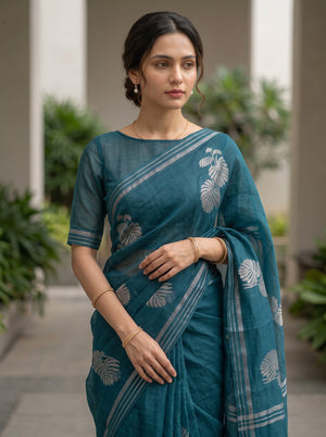 Organza Teal Self-Tone Botanical Motif Saree with Striped Pallu Border and Tassels