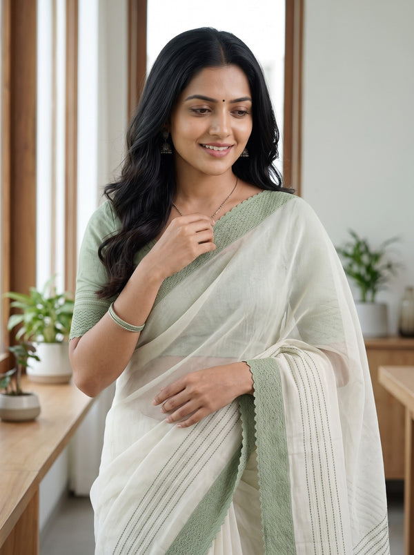 Net Kota Off White Saree with Green Line Pattern and Floral Motif Detail with Green Border Pallu