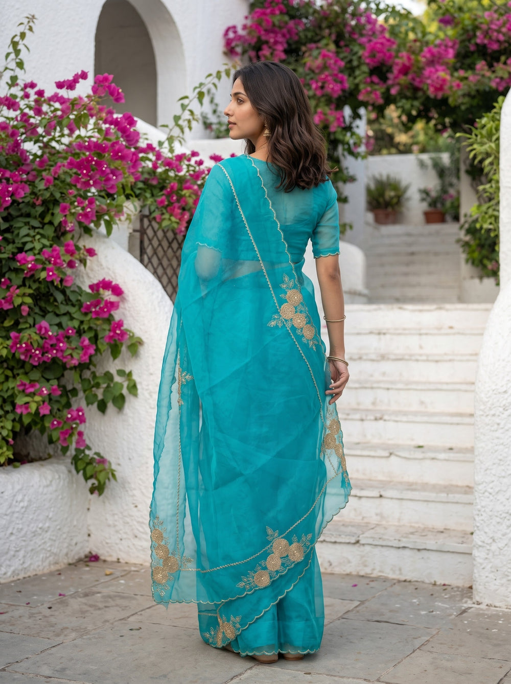Organza Peacock Blue Saree with Golden Zari Rosette Border