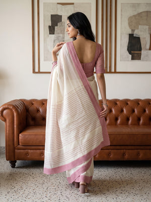 Net Kota Off White Saree with Pink Striped Pattern and Floral Motif Pallu with Textured Pink Border