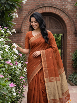 Cotton Rust Orange Saree with Geometric Patterned Pallu and Tassels