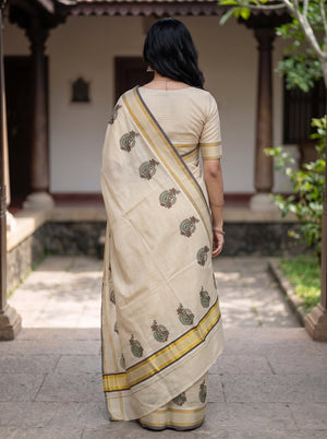 Tissue Cream Kerala Saree with Paisley Motif Print Pallu and Golden Zari Checks
