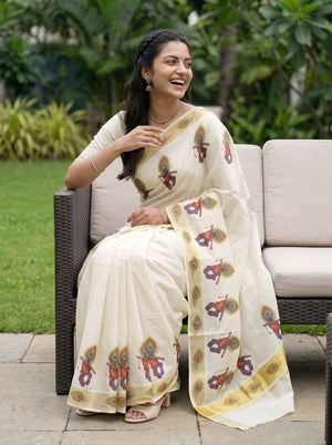 Tissue Cream Kerala Saree with Krishna Peacock Feather Print Pallu and Golden Zari Border
