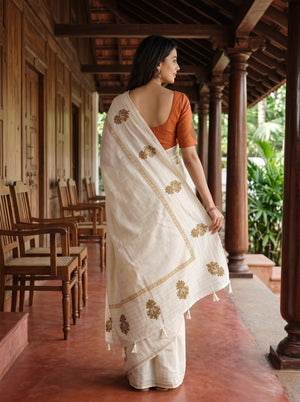 Semi Tussar Silk Cream Saree with Floral Embroidery border and Tassel Detailing