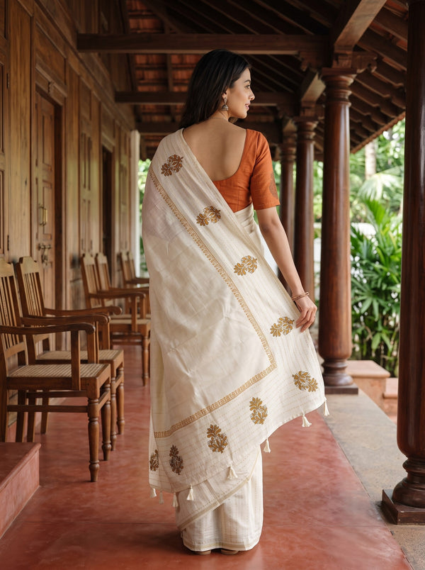 Semi Tussar Silk Cream Saree with Floral Embroidery border and Tassel Detailing