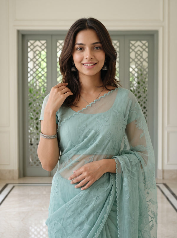Net Kota Saree in Aqua Green with All-Over Floral Embroidery and Scalloped Border